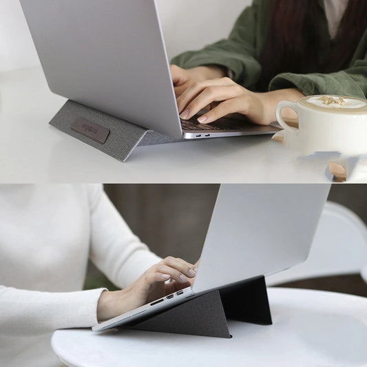 Magnetic laptop stand positioned on a desk