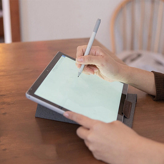 Portable laptop stand with adjustable angle on a table